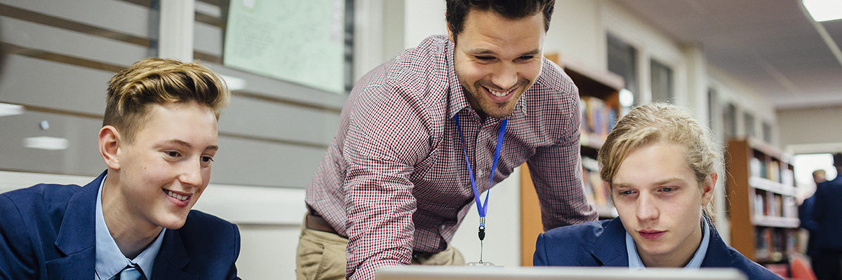 Young white man secondary pupils laptop